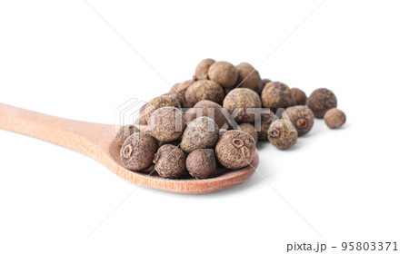 Spicy black pepper grains isolated on white Spicy black pepper grains isolated on white 95803371