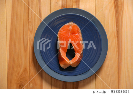 Fresh raw fish steak on wooden table, top view Fresh raw fish steak on wooden table, top view 95803632