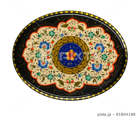 A closeup of a round casket with an artistic painting on a white background. Central Asia, Uzbekistan 95804196