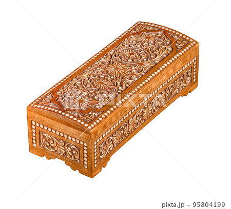 A wooden casket with traditional artistic carving isolated on a white background 95804199
