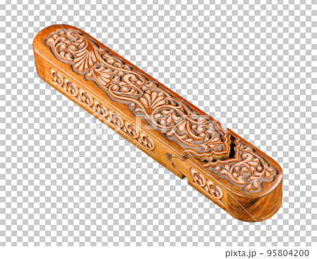 The artistic wood carving on the pencil case on a white background. Central Asia, Uzbekistan 95804200