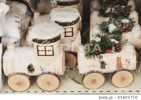 Children's wooden birch train for Christmas in a shop Children's wooden birch train for Christmas in a shop 95805750