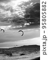 Two silhouette of power kites at sunset sky. Black and white. 95805882