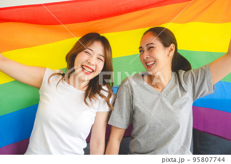 Portrait of happy smile southeast asian woman lgbt couple with rainbow pride flag 95807744