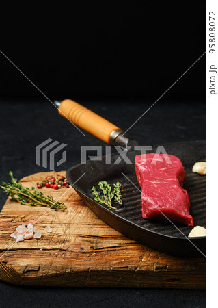 Raw boneless beef tri-tip steak on frying pan Raw boneless beef tri-tip steak on frying pan 95808072