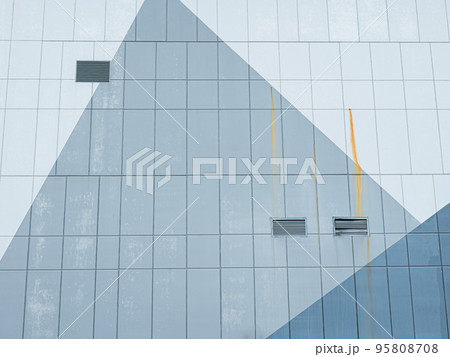 The wall surface of the shopping mall outside the building has a contrasting pattern. will have air vents and there was rust stains flowing in the way The wall surface of the shopping mall outside the building has a contrasting pattern. will have air vents and there was rust stains flowing in the way 95808708