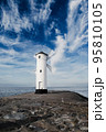 Old windmill lighthouse in Swinoujscie, a port in Poland on the Baltic Sea. 95810105