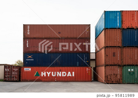 Zemst, Flemish Brabant Region, Belgium - Cargo containers stacked at an industrial storage near the canal Zemst, Flemish Brabant Region, Belgium - Cargo containers stacked at an industrial storage near the canal 95811989