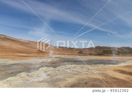 Closeup of Namafjall is Iceland popular geothermal area with a unique landscape of steaming pools and mudpots Closeup of Namafjall is Iceland popular geothermal area with a unique landscape of steaming pools and mudpots 95812302