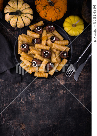 Halloween pasta with meatballs in shape of eye Halloween pasta with meatballs in shape of eye 95814894