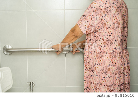 Asian senior or elderly old lady woman patient use toilet bathroom handle security in nursing hospital ward, healthy strong medical concept. Asian senior or elderly old lady woman patient use toilet bathroom handle security in nursing hospital ward, healthy strong medical concept. 95815010
