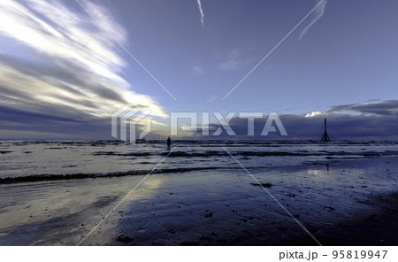 Sunset on Crosby Beach in winter, Crosby, Liverpool, United Kingdom Sunset on Crosby Beach in winter, Crosby, Liverpool, United Kingdom 95819947