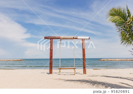 Swing on white beach bar cafe, decorated for photography. 95820891