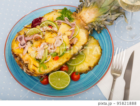 Stuffed pineapple with squid and lime. Stuffed pineapple with squid and lime. 95821888