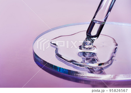 Pipette with sample of cosmetic product in petri dish on holographic background, iridescent highlights, selective focus Pipette with sample of cosmetic product in petri dish on holographic background, iridescent highlights, selective focus 95826567