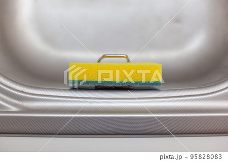 Sponge for washing dishes. Storage ideas, sink in the kitchen.  95828083
