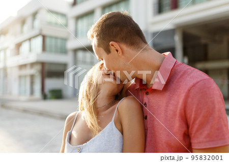 Lovely happy couple.Hugs together and kiss in sunset light 95832001