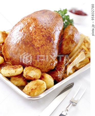 Whole roasted chicken with potatoes Whole roasted chicken with potatoes 95832780