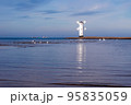 Old windmill lighthouse in Swinoujscie, a port in Poland on the Baltic Sea. 95835059