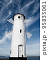 Old windmill lighthouse in Swinoujscie, a port in Poland on the Baltic Sea. 95835061