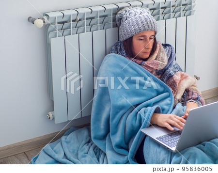 Woman sitting near the battery Woman sitting near the battery 95836005