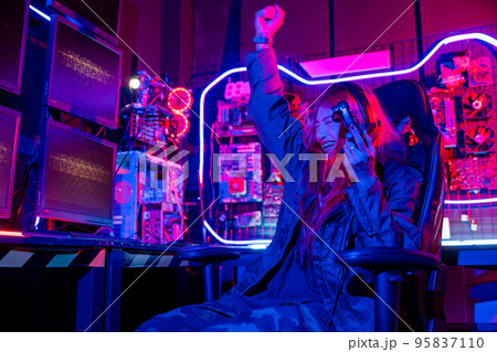 Gamer using joystick controller for virtual tournament plays online video game 95837110