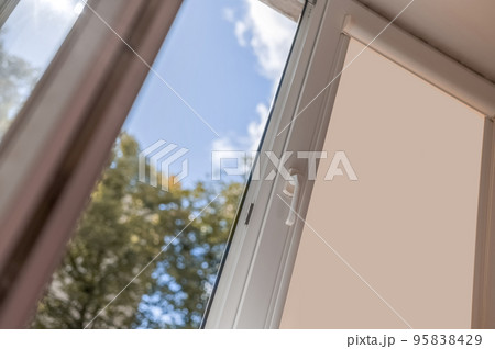 open white pvc plastic window. Airing the room on a fine summer day. open white pvc plastic window. Airing the room on a fine summer day. 95838429