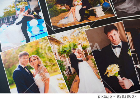 printed wedding photos on a black background. 95838607