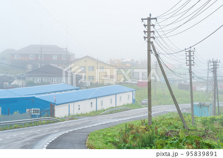view of the village of Yuzhno-Kurilsk on the island of Kunashir during fog 95839891