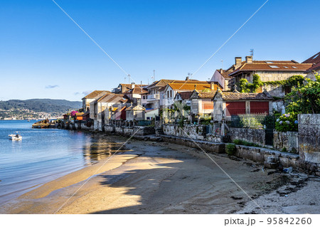 Fishing village of Combarro with the typical granary horreos. Galicia, Spain. 95842260