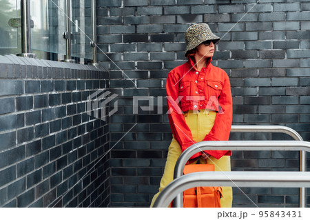 Hipster fashion young woman in bright clothes,の写真素材