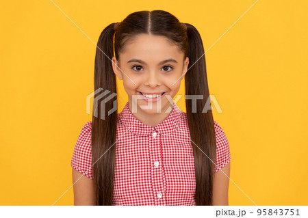 Innocent girl child happy smiling yellow background, girlhood 95843751