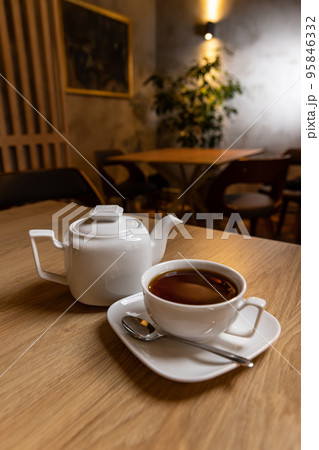 White porcelain tea cup and teapot 95846332