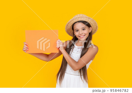 teen child smile with copy space on orange paper on yellow background teen child smile with copy space on orange paper on yellow background 95846782