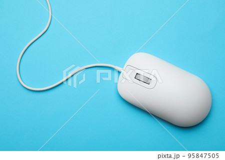 Wired computer mouse on light blue background, top view Wired computer mouse on light blue background, top view 95847505