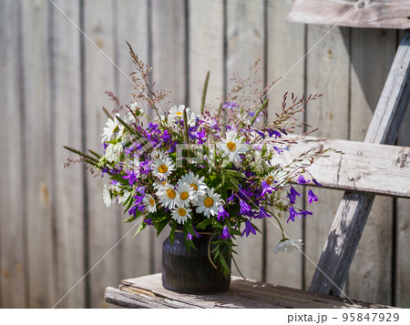 Bouqet with wild flowers. Cottagecore concept Bouqet with wild flowers. Cottagecore concept 95847929