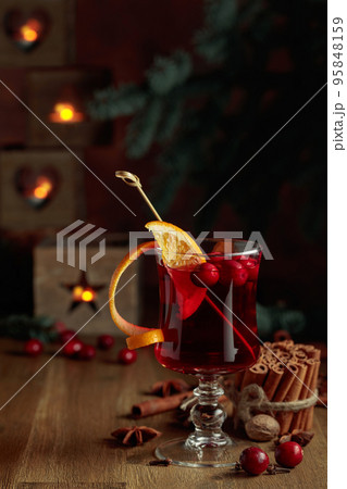 Christmas drink with spices, orange, and cranberries. 95848159