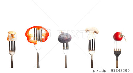 Fruits and vegetables on the forks. Healthy food 95848399