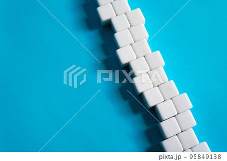Chain of blocks on a blue background. Abstraction structure. concept of organization and strength. Unity and Consolidation. Orderly system. Stability, steadfastness. Construction and creation 95849138