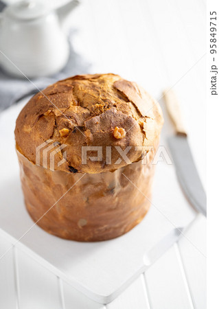 Panettone Christmas Cake. Italian sweet bread on white kitchen table. 95849715