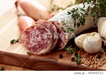 Traditional dry-cured sausage with thyme, garlic, onion, and spices. Traditional dry-cured sausage with thyme, garlic, onion, and spices. 95849722