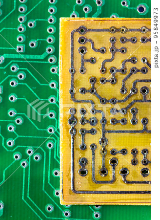 Printed green and yellow circuit boards. Electronic computer hardware technology macro. A digital motherboard chip. Microprocessor, transistors, semiconductor made from silicon. Technical science. Printed green and yellow circuit boards. Electronic computer hardware technology macro. A digital motherboard chip. Microprocessor, transistors, semiconductor made from silicon. Technical science. 95849973