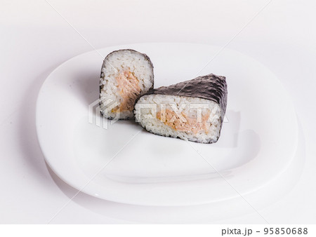 Onigiri with tuna salad as an ingredient. A traditional Japanese dish. In Japan, it is called tuna mayo or sea chicken mayonnaise. Onigiri with tuna salad as an ingredient. A traditional Japanese dish. In Japan, it is called tuna mayo or sea chicken mayonnaise. 95850688