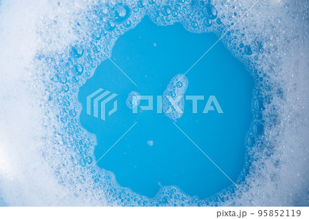 Detergent foam bubble, blue background. Detergent foam bubble, blue background. 95852119