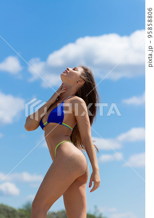 Charming woman in bikini on beach 95858806