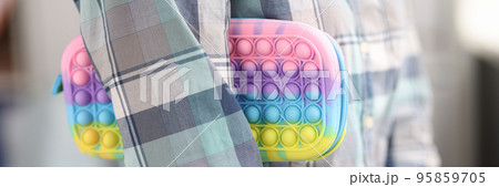 Woman hold bright pops it pencil case, school pencil case for stationery Woman hold bright pops it pencil case, school pencil case for stationery 95859705