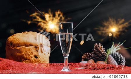 Panettone And Glasses Of Champagne on table 95866758