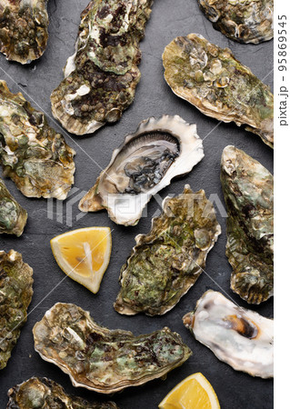 Fresh oysters with lemons Fresh oysters with lemons 95869545