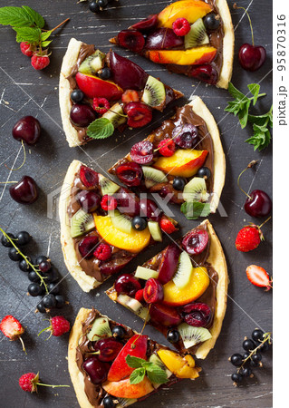 Pizza menu. Summer fruit berry pizza with chocolate paste. Vitamin dessert. Top view flat lay background. 95870316
