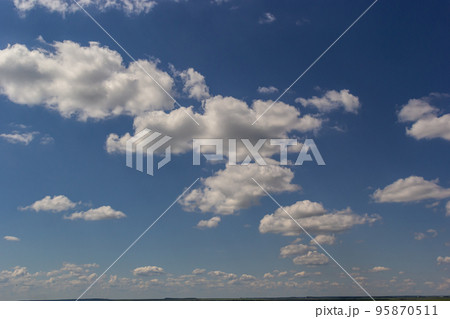 clouds in the sky lit by the sun on a summer day. background clouds in the sky lit by the sun on a summer day. background 95870511
